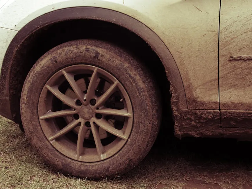 thick mud caked on a 4WD wheel and underbody after a Cairns off-road trip