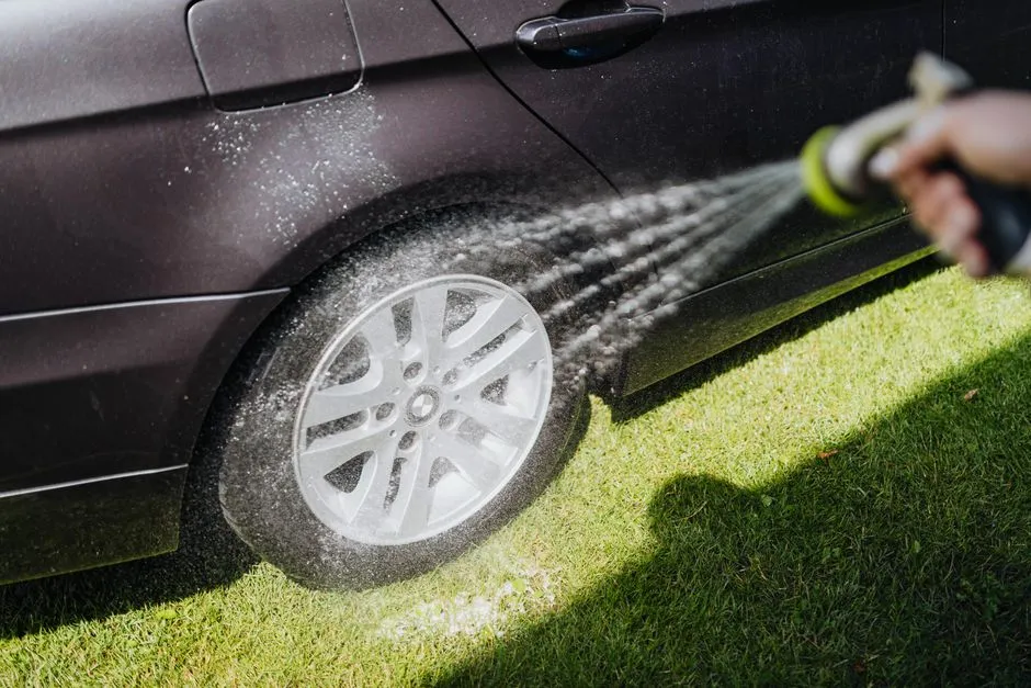 underbody of a 4WD being pressure washed to remove mud and prevent rust