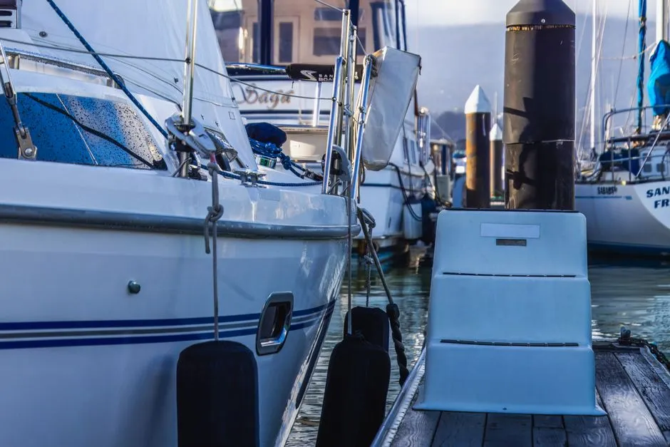 boat moored at a Cairns marina with a clean polished white hull