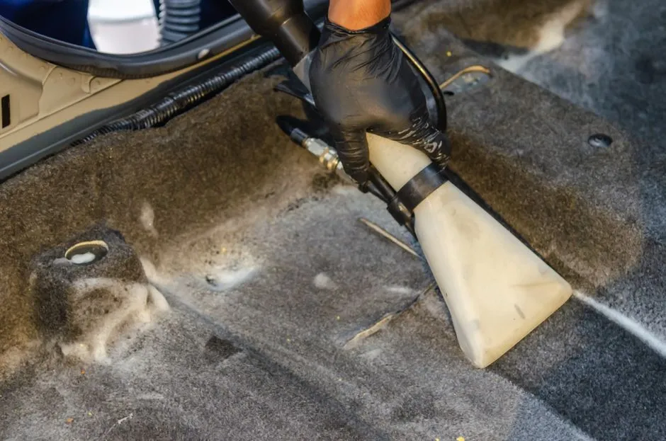 vacuuming a car interior to remove mould spores