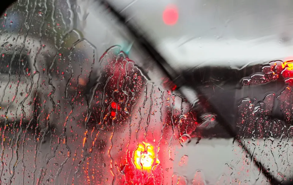 rain beading on a car windscreen during wet season in Cairns
